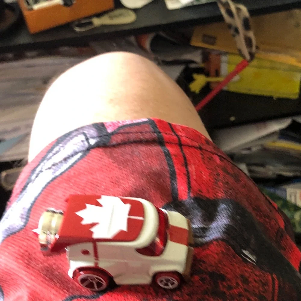 Red & White Maple Leaf Toy Car